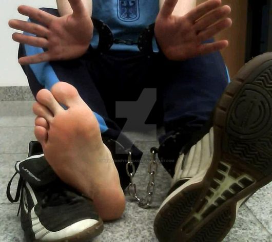 handcuffed_boy_showing_naked_and_chained_feet__by_sneakerboybondage-d9ul8u9.png